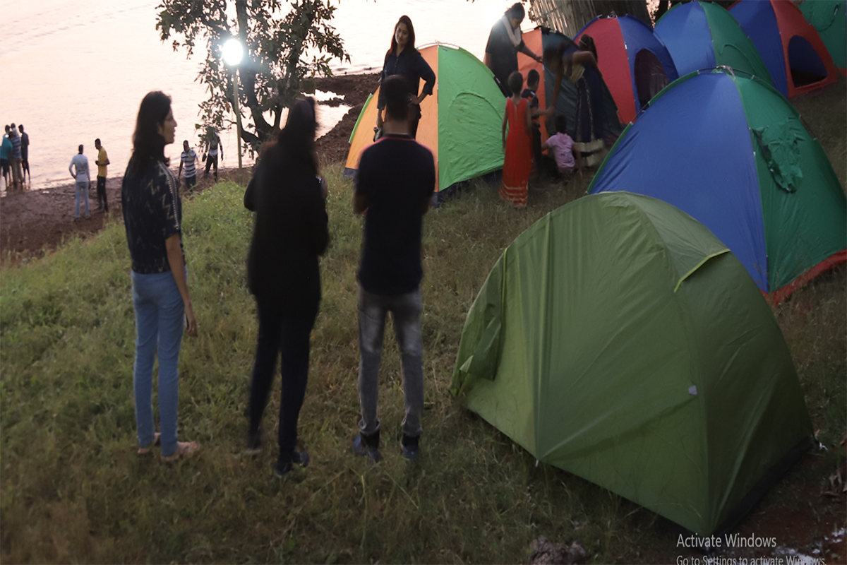 Lakeside camping at Vasota with tents overlooking Koyna backwaters